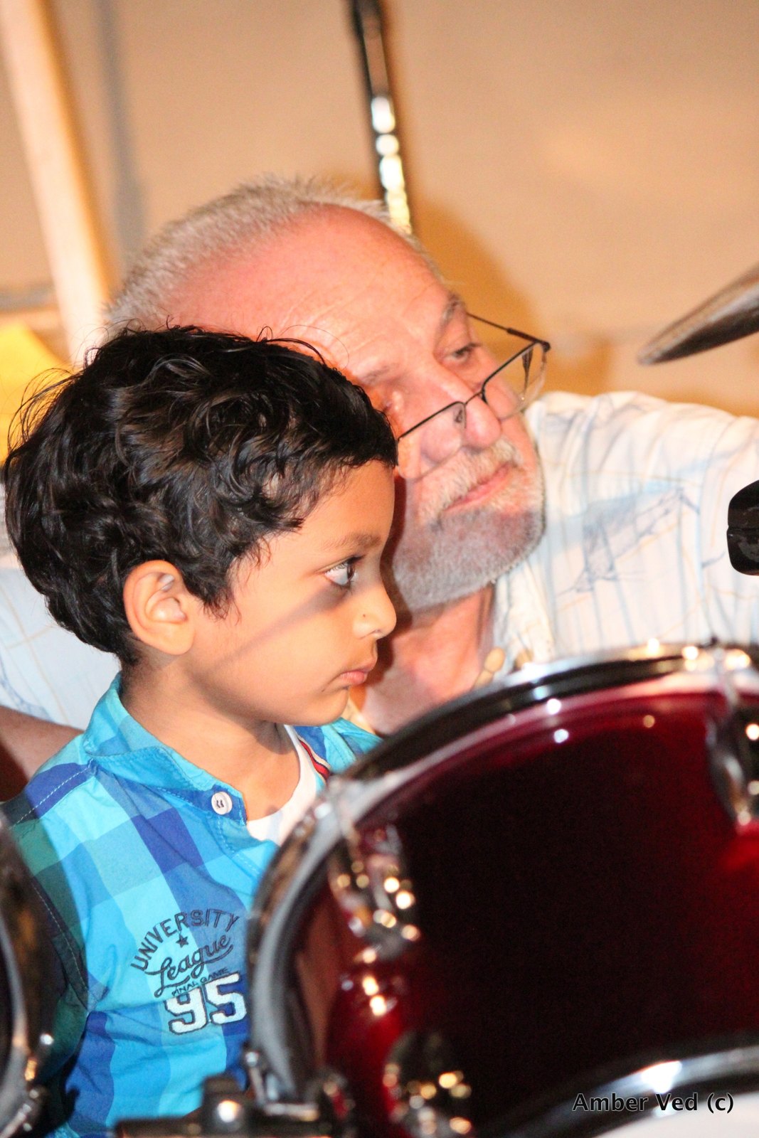 At the drums.